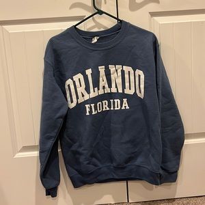 Blue Orlando Florida crew neck sweatshirt.